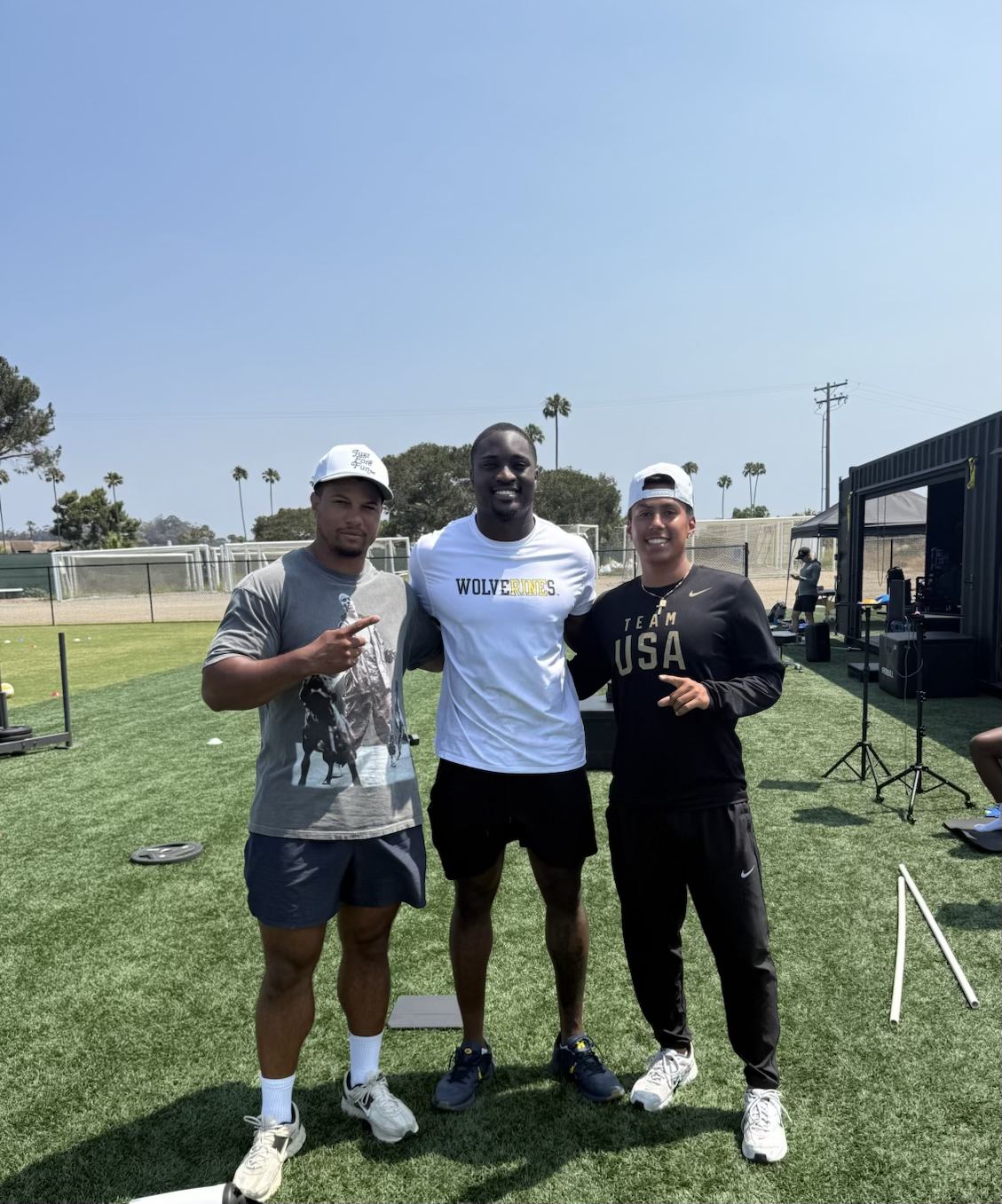 Christopher Mullen with athletes at a training facility